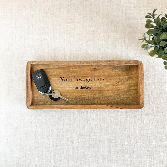 Mango wood tray for keys with the engraved phrase "'Your keys go here.' - St. Anthony"